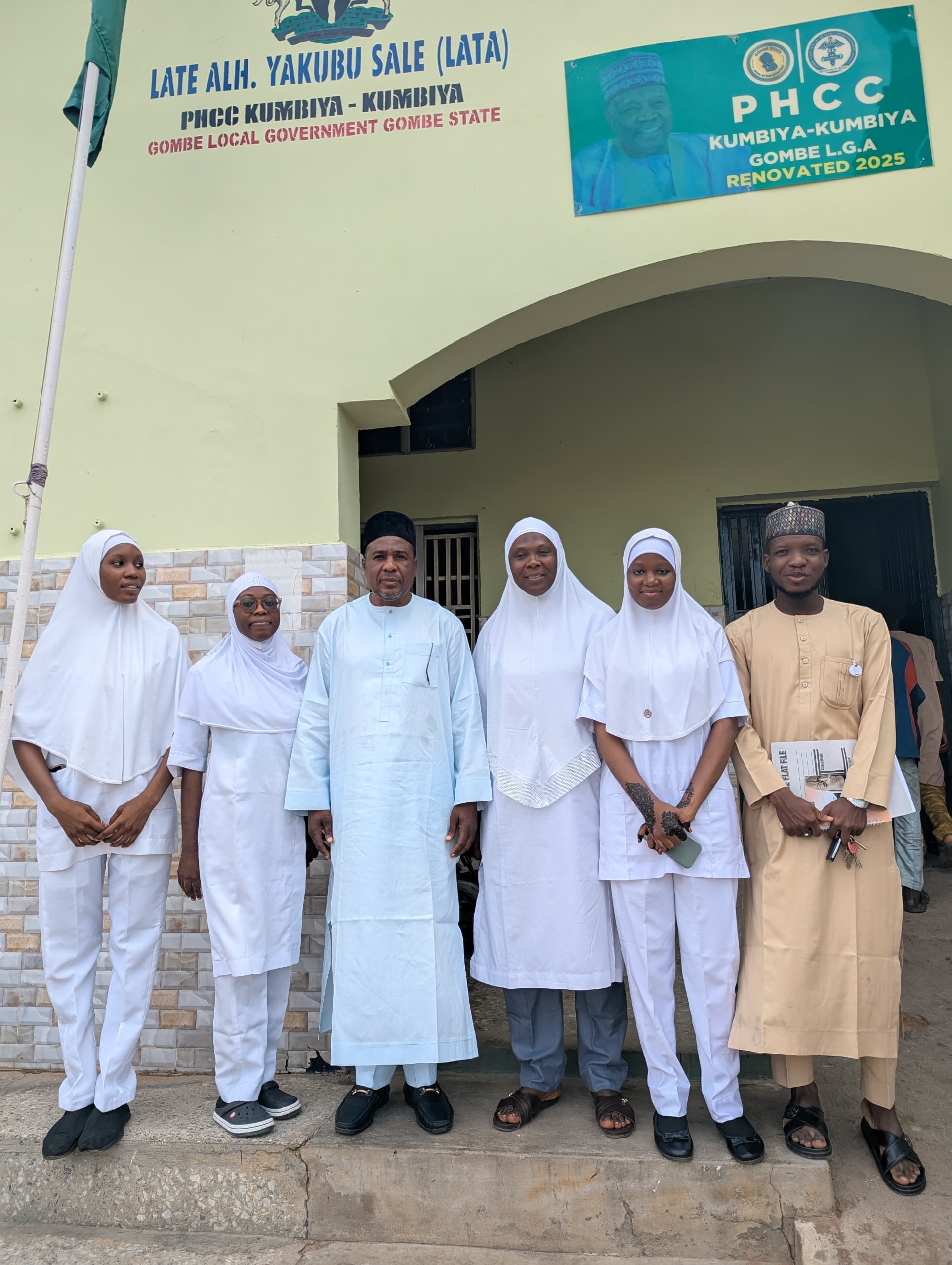 NJFP fellows and facility staff outside PHCC Kumbiya-Kumbiya, a renovated primary healthcare centre in Gombe LGA, Gombe State
